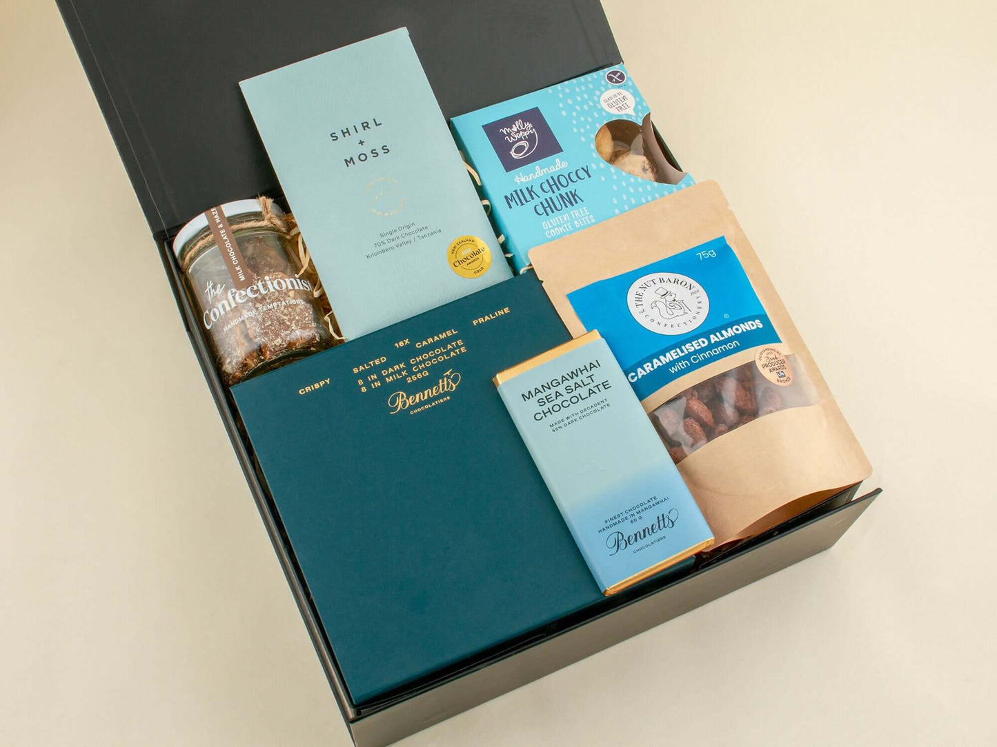 Sweet Blue Treat Box featuring cookies, chocolate, and caramelized nuts in a stylish gift box.